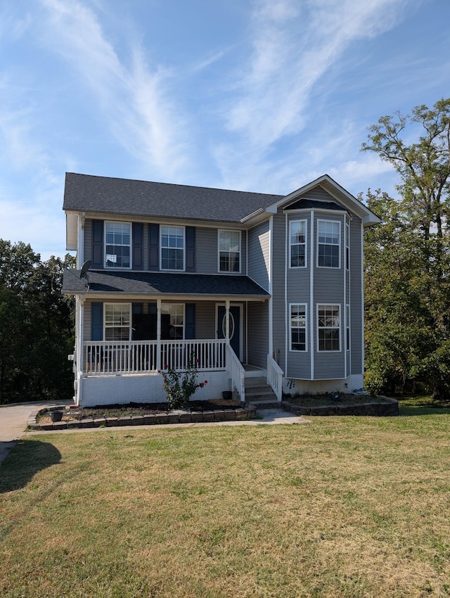 view of front facade with a porch and a front yard