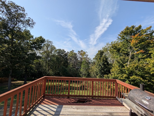 wooden deck featuring area for grilling