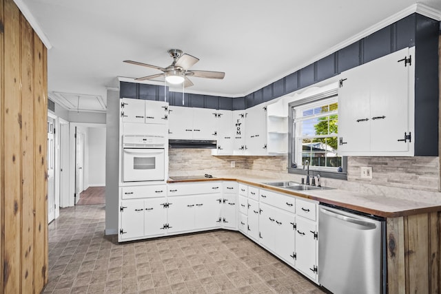 kitchen with sink, white oven, white cabinets, and dishwasher