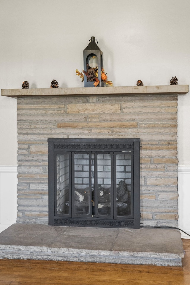 room details featuring hardwood / wood-style floors and a fireplace