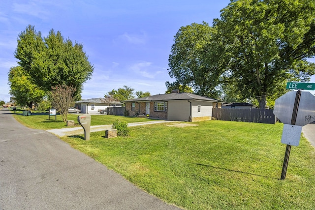 view of front of home featuring a front lawn