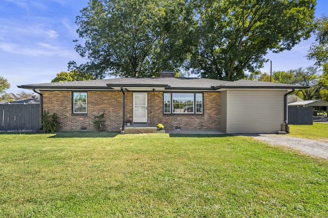 ranch-style home featuring a front yard