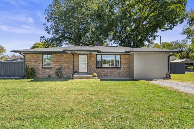 201 Lee Ave, Portland, TN 37148 - ranch-style home with brick siding, a chimney, fence, and a front yard