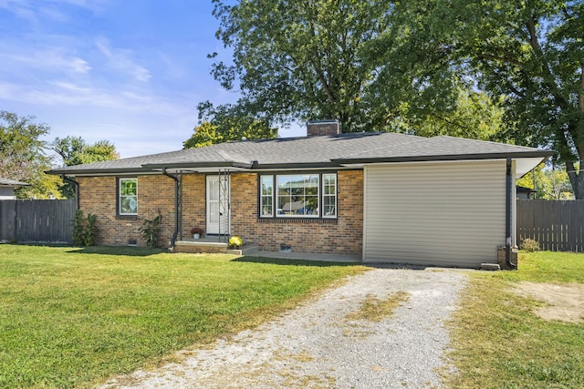 ranch-style home featuring a front yard