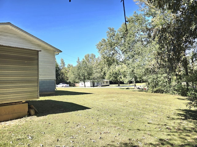 view of yard featuring a garage