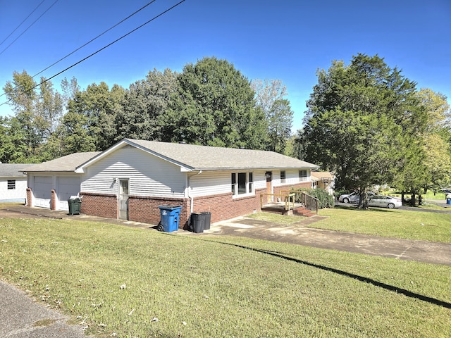 view of front of house with a front lawn and a garage