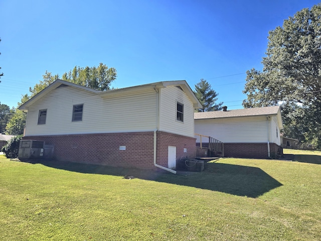 view of home's exterior featuring a yard