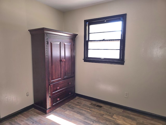 spare room featuring hardwood / wood-style flooring