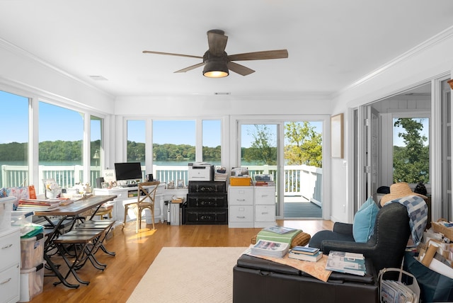 sunroom / solarium with ceiling fan