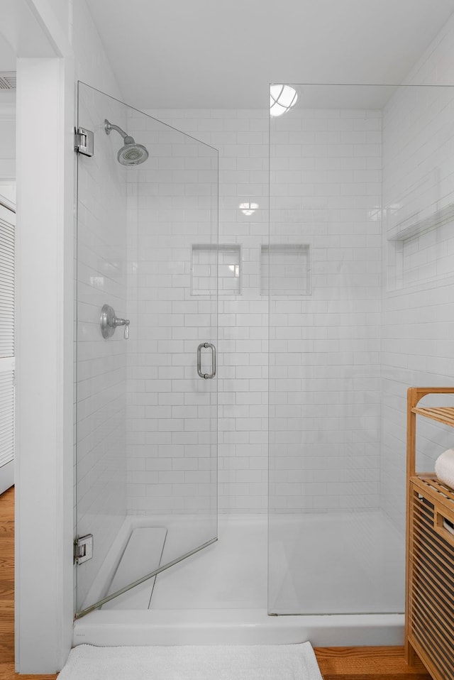 bathroom featuring an enclosed shower