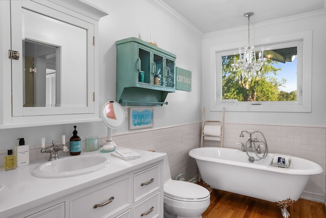 bathroom with hardwood / wood-style flooring, crown molding, tile walls, and a tub