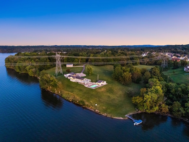 aerial view at dusk with a water view