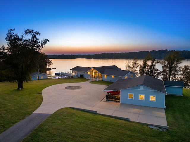 aerial view at dusk with a water view