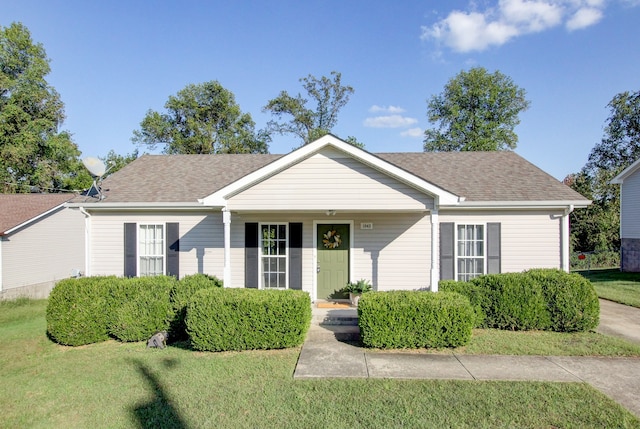 ranch-style home featuring a front yard