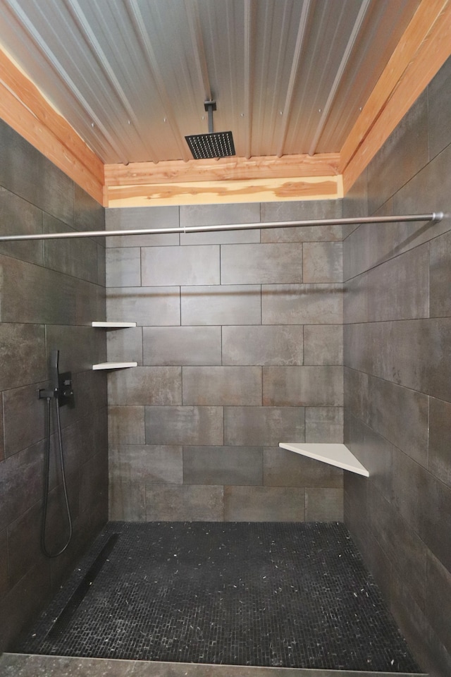 bathroom with a tile shower