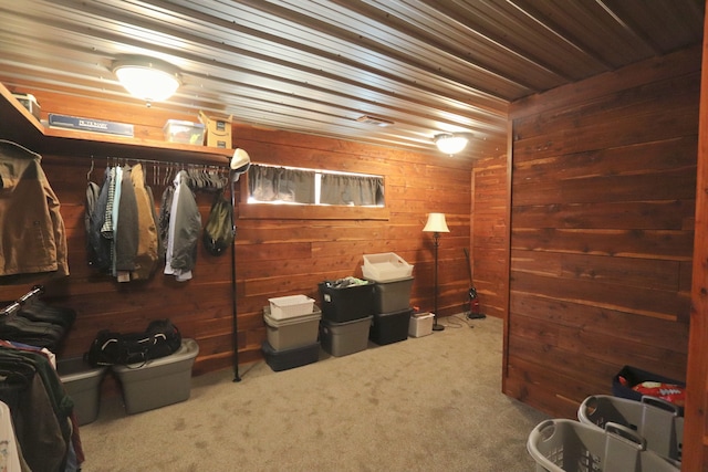 walk in closet featuring carpet flooring