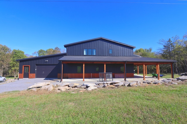 view of front of property with a front yard and a garage