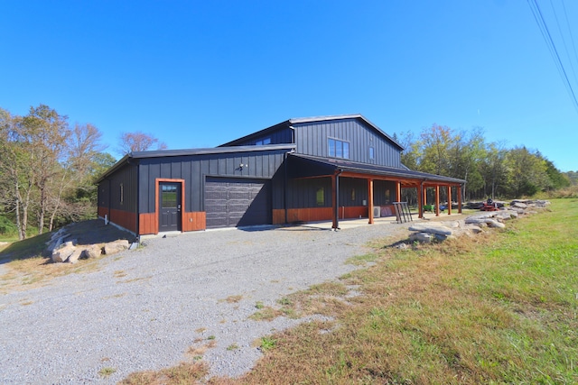 exterior space featuring a garage and a front lawn