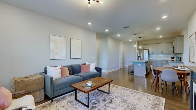 living room with dark hardwood / wood-style flooring