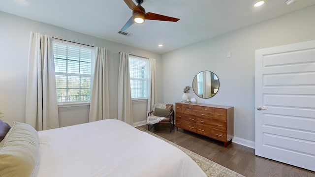 bedroom featuring ceiling fan and dark hardwood / wood-style flooring