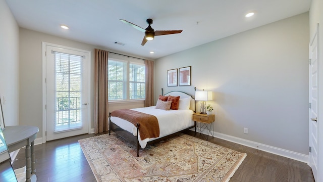 bedroom featuring access to exterior, ceiling fan, and dark hardwood / wood-style flooring