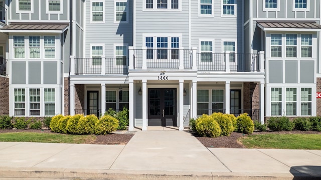 view of front of house featuring a balcony