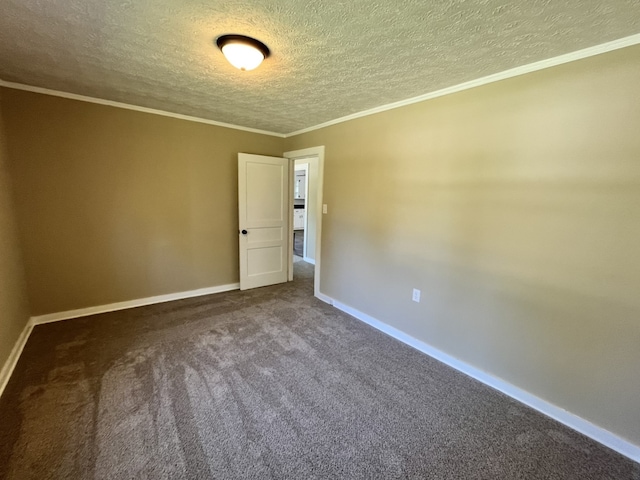 carpeted empty room featuring a textured ceiling and crown molding