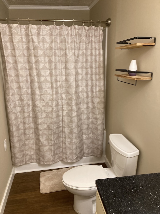 full bathroom with vanity, ornamental molding, shower / bath combo with shower curtain, hardwood / wood-style flooring, and toilet