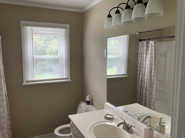 bathroom with vanity, a textured ceiling, crown molding, toilet, and a shower with shower curtain