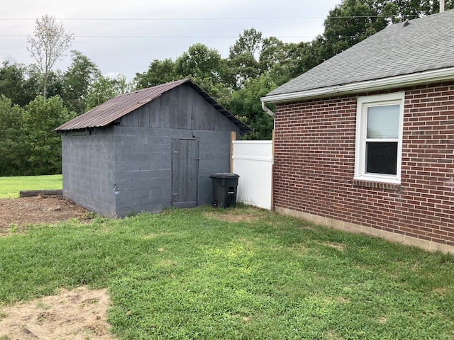 view of outbuilding with a lawn