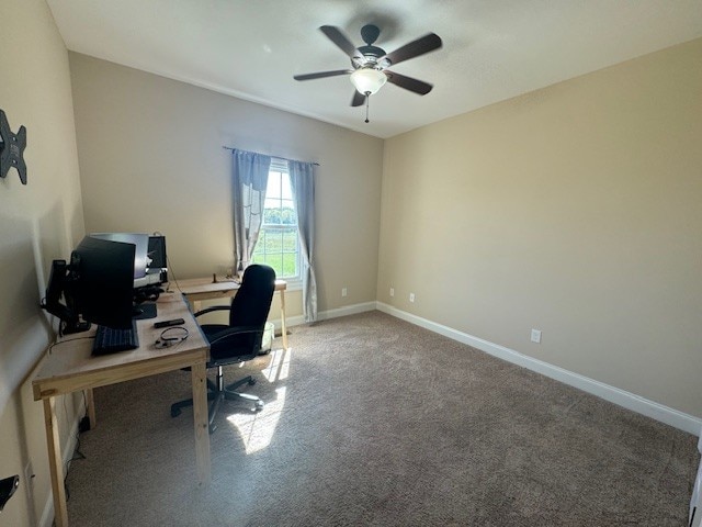 office with carpet flooring and ceiling fan