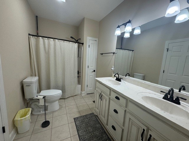 full bathroom featuring tile patterned floors, shower / bath combination with curtain, vanity, and toilet