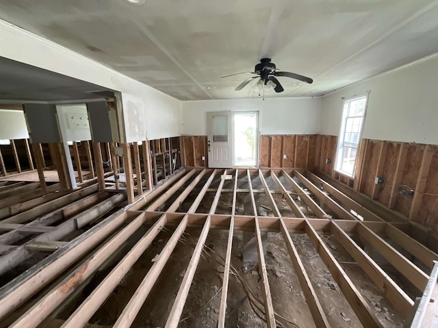 empty room featuring ceiling fan and a wealth of natural light