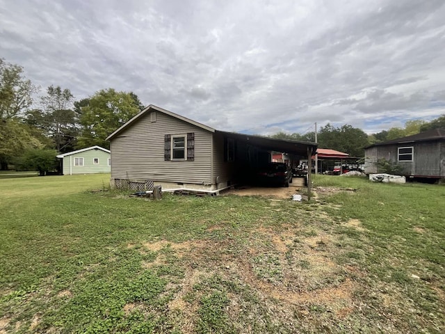 view of property exterior featuring a carport and a lawn