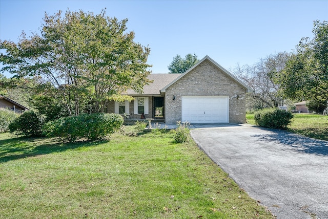 ranch-style home with a front lawn and a garage