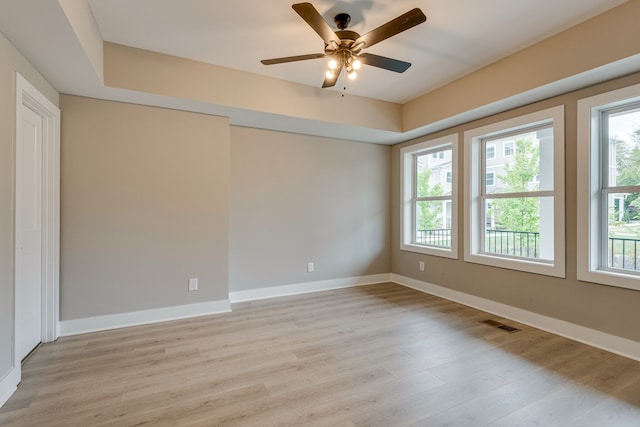 unfurnished room with ceiling fan and light hardwood / wood-style flooring