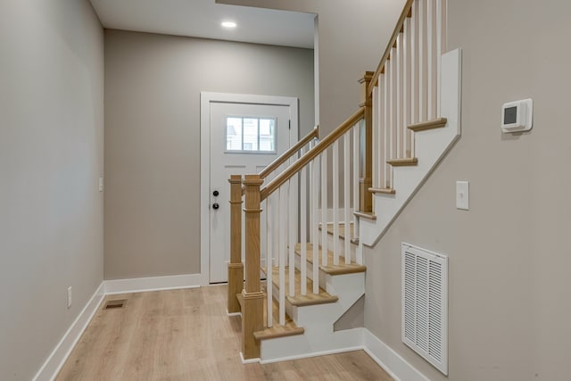 entryway with light hardwood / wood-style floors