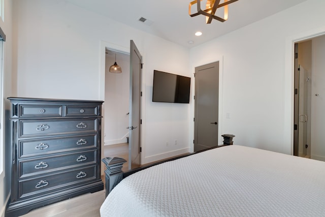 bedroom with light hardwood / wood-style flooring