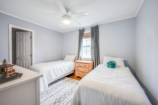 bedroom featuring ornamental molding and ceiling fan