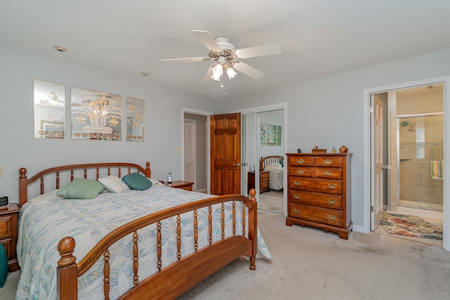 carpeted bedroom with ceiling fan, a closet, and connected bathroom