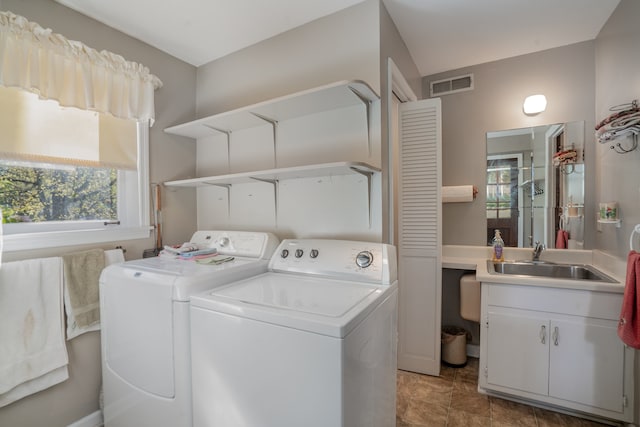 laundry area featuring sink and washer and dryer