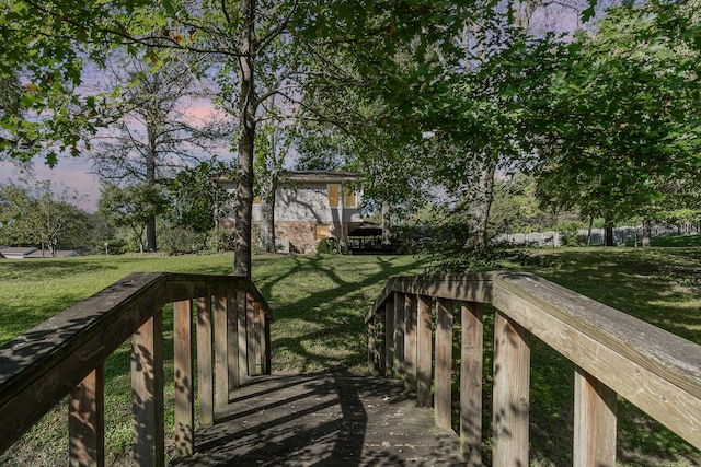 exterior space with a yard and a wooden deck