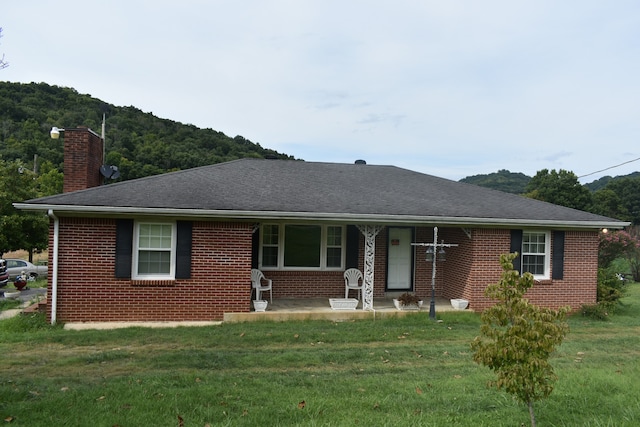 ranch-style home with a front lawn