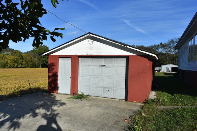 garage featuring a yard