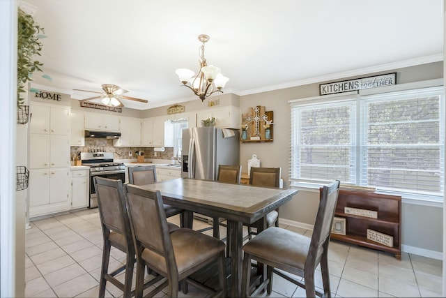 dining space featuring ceiling fan with notable chandelier, ornamental molding, sink, and light tile patterned floors