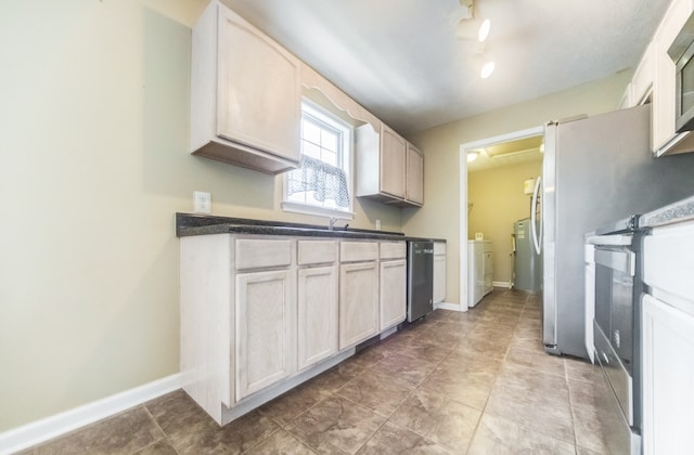 kitchen with appliances with stainless steel finishes and light brown cabinets