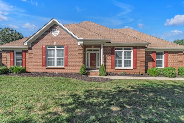 ranch-style home with a front lawn