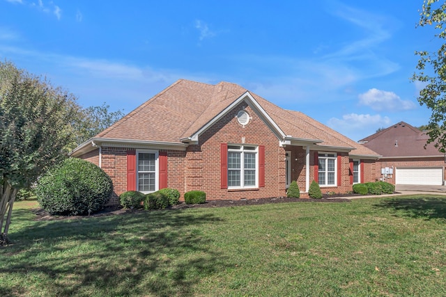 view of front of home with a garage and a front yard