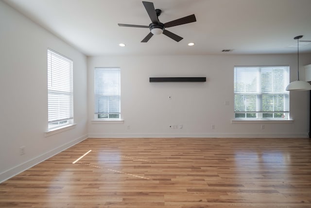 unfurnished room with a wealth of natural light and light wood-type flooring