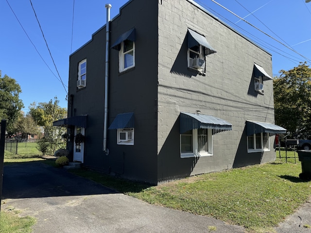 view of home's exterior featuring a yard